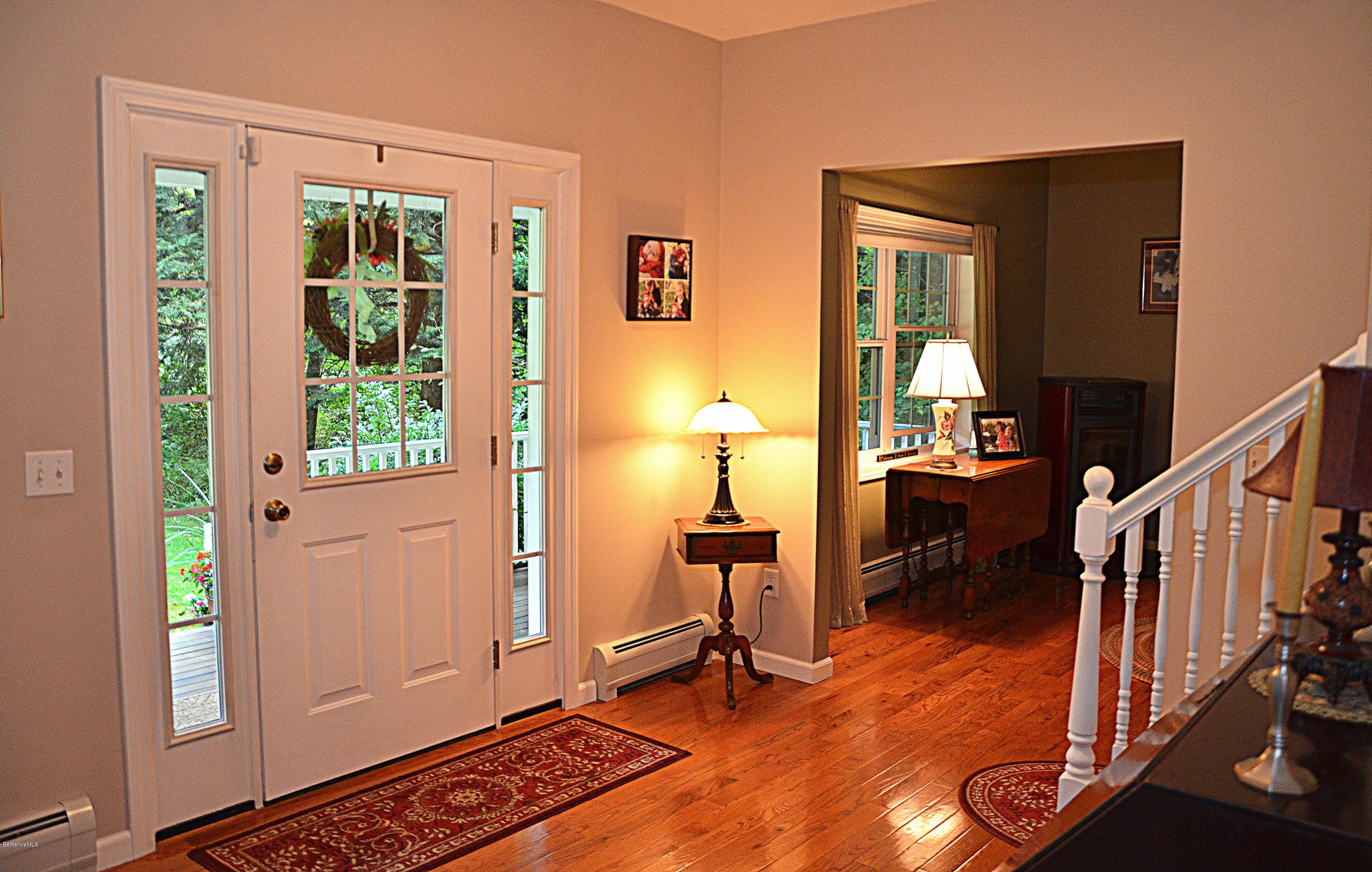 735 Upper Valley Road Washington, MA 01223 - Photo 7 of 33 a view of an entryway with wooden floor and windows