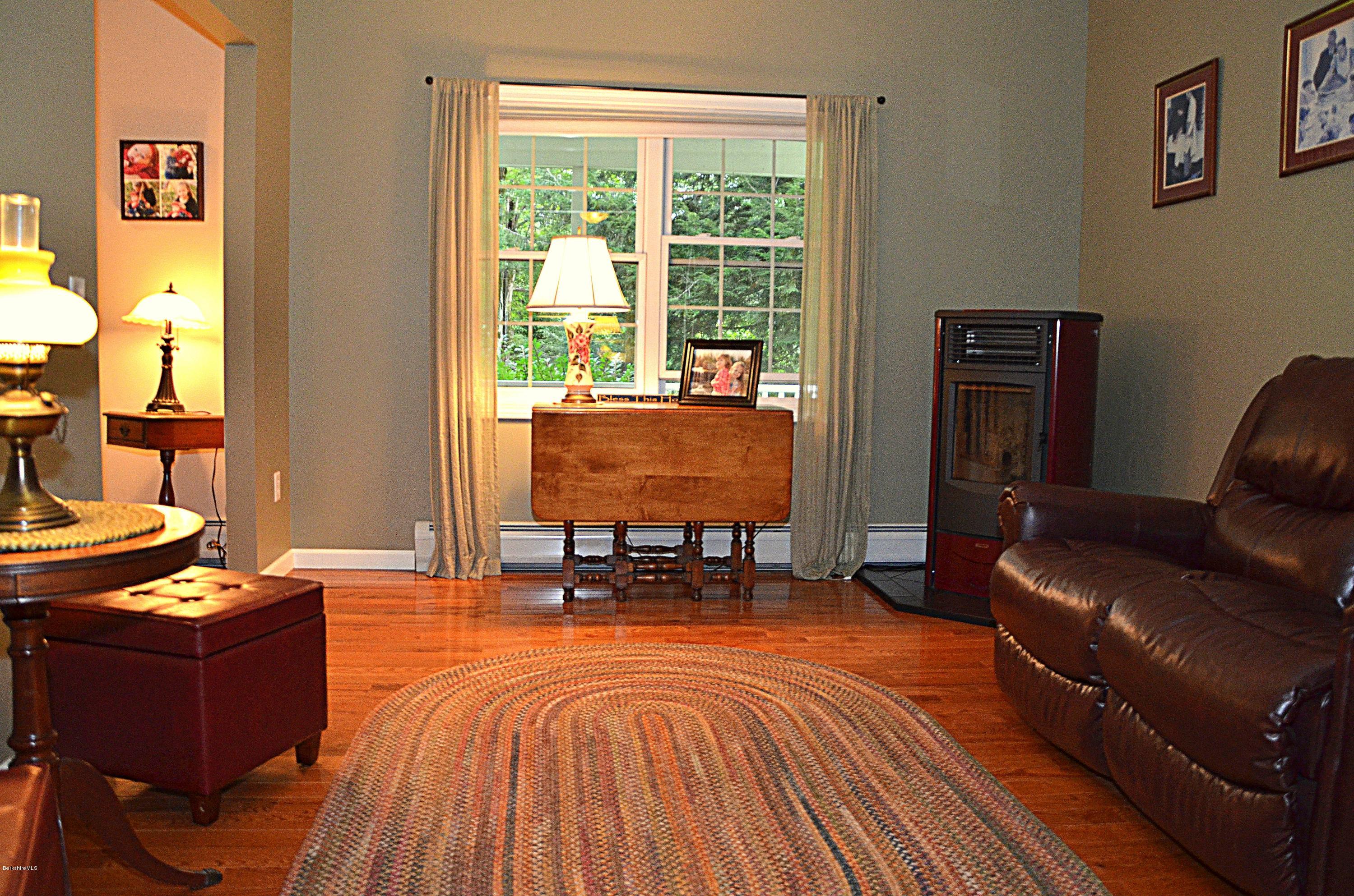 735 Upper Valley Road Washington, MA 01223 - Photo 8 of 33 a room with furniture and a floor to ceiling window