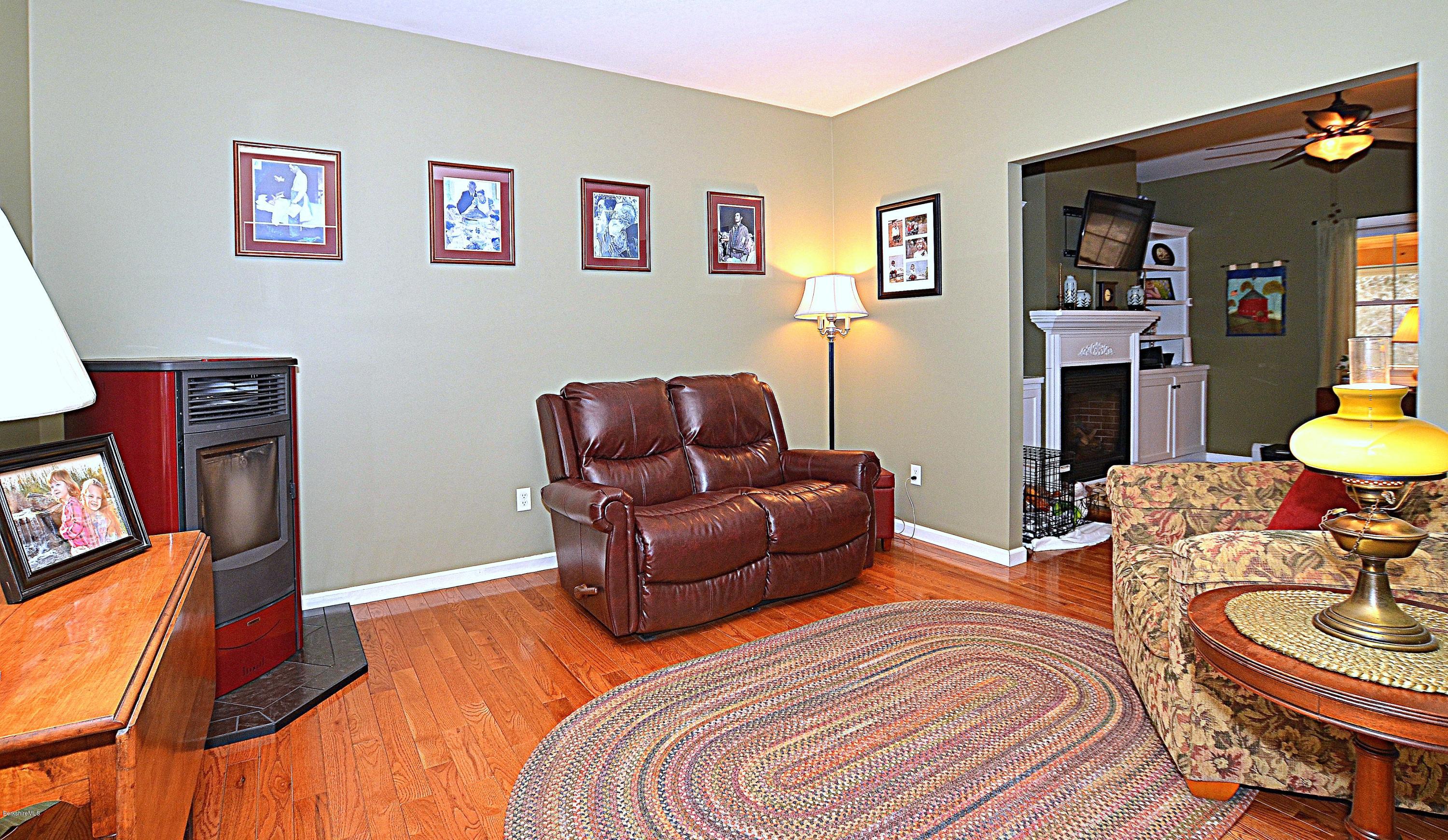 735 Upper Valley Road Washington, MA 01223 - Photo 9 of 33 a living room with furniture and a fireplace
