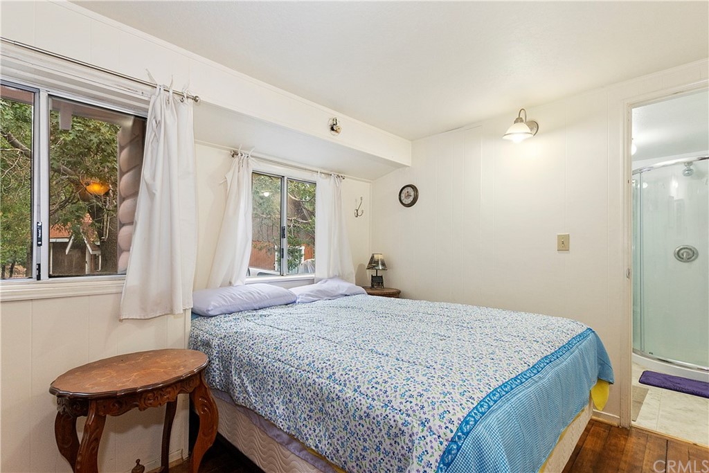 1211 Bridal Path Rimforest, CA 92378 - Photo 17 of 28 a bedroom with a bed and window