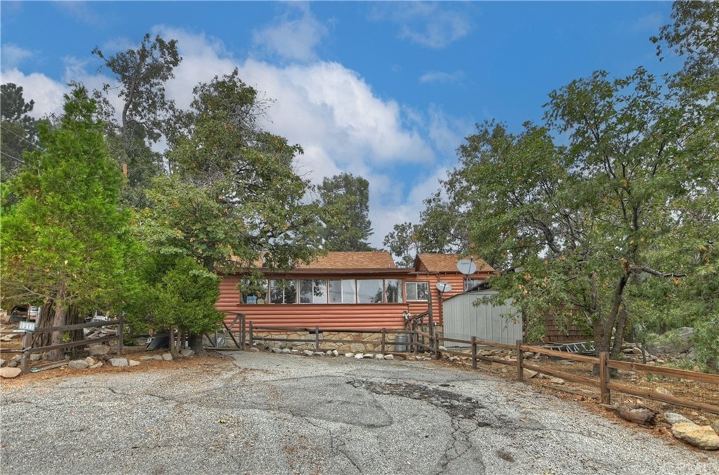1211 Bridal Path Rimforest, CA 92378 - Photo 2 of 28 front view of a house with a tree