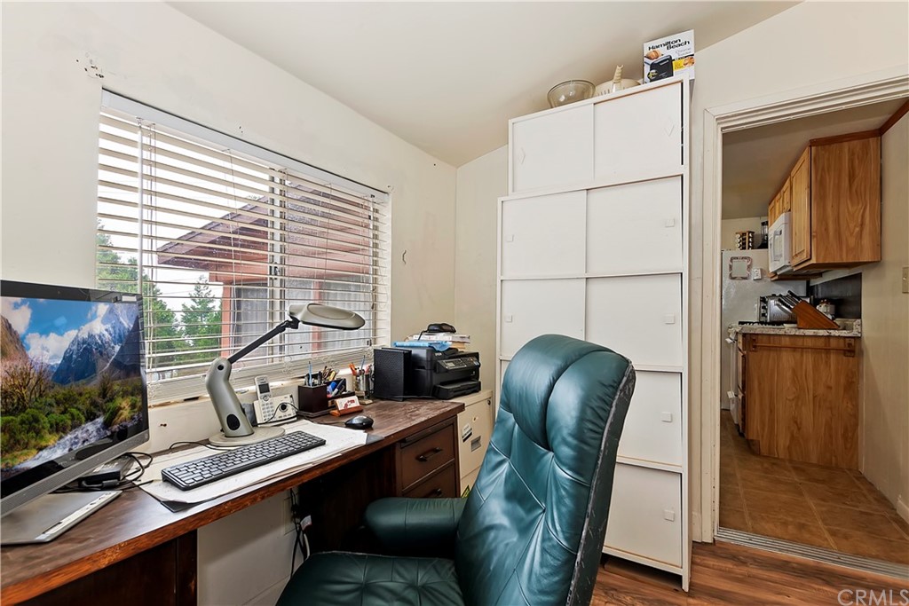 1211 Bridal Path Rimforest, CA 92378 - Photo 21 of 28 a view of a workspace with furniture and a window