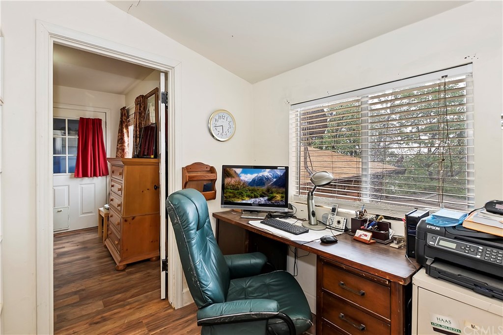 1211 Bridal Path Rimforest, CA 92378 - Photo 22 of 28 a view of a workspace with furniture and a window