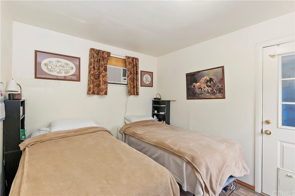 1211 Bridal Path Rimforest, CA 92378 - Photo 23 of 28 a bedroom with bed and wall painting