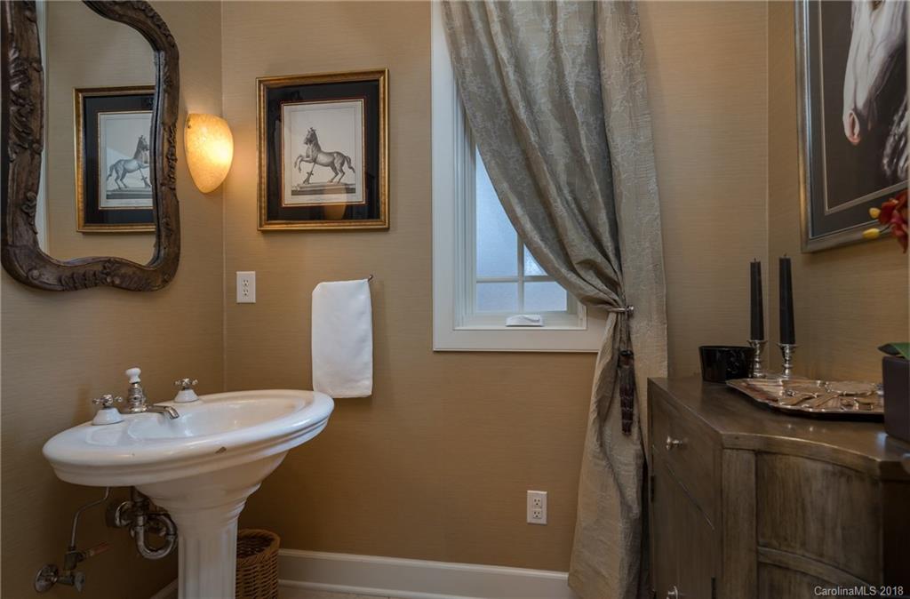 485 North Campbell Road Landrum, SC 29356 - Photo 2 of 22 a bathroom with a sink and a mirror