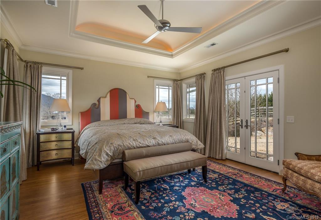 485 North Campbell Road Landrum, SC 29356 - Photo 15 of 22 a bedroom with a bed and wooden floor