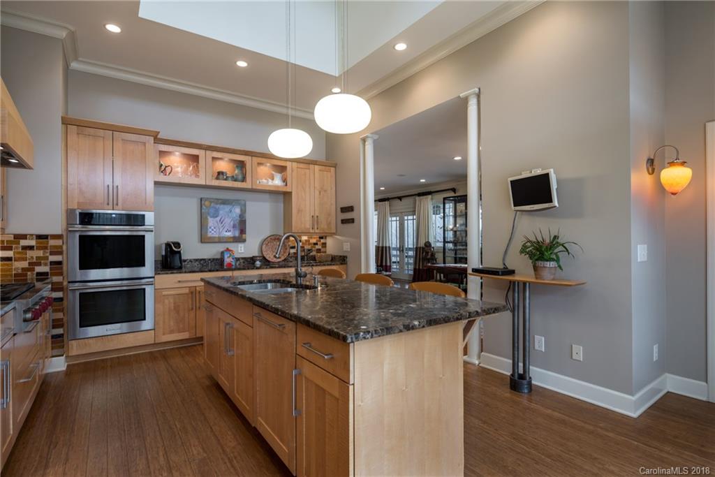 485 North Campbell Road Landrum, SC 29356 - Photo 6 of 22 a kitchen with stainless steel appliances granite countertop a sink a stove top oven a counter space and cabinets