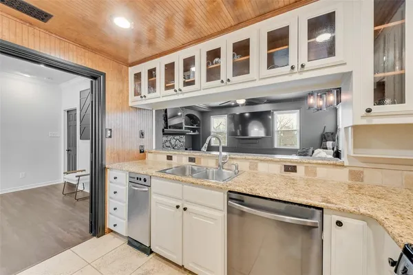 a kitchen with a sink and cabinets