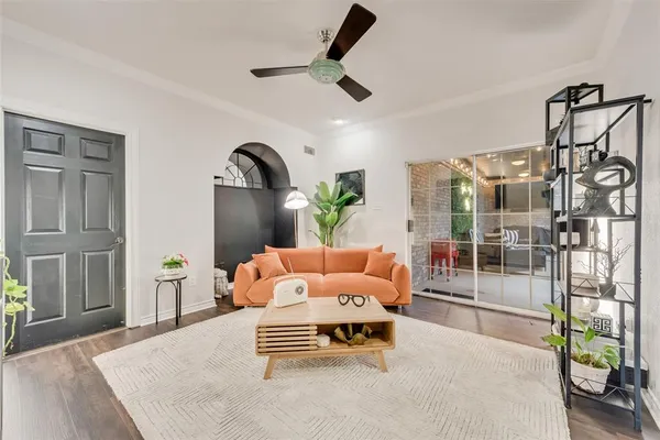 a bedroom with furniture and a window