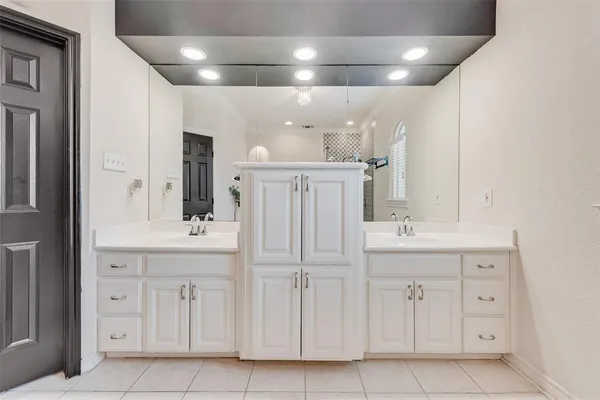 a bathroom with a sink a vanity and a mirror