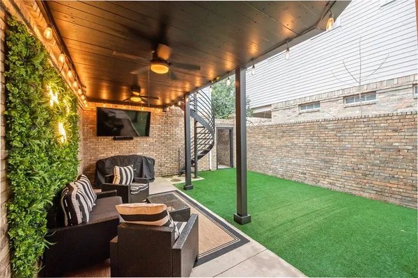 a view of backyard with sitting area