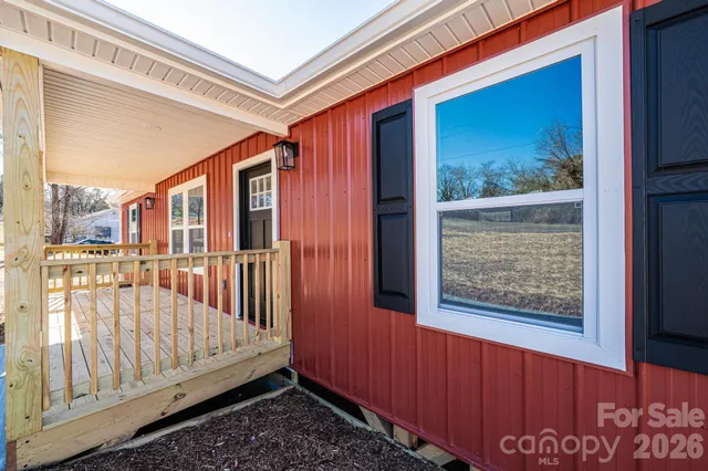 a kitchen with stainless steel appliances granite countertop a refrigerator a stove and a wooden floors