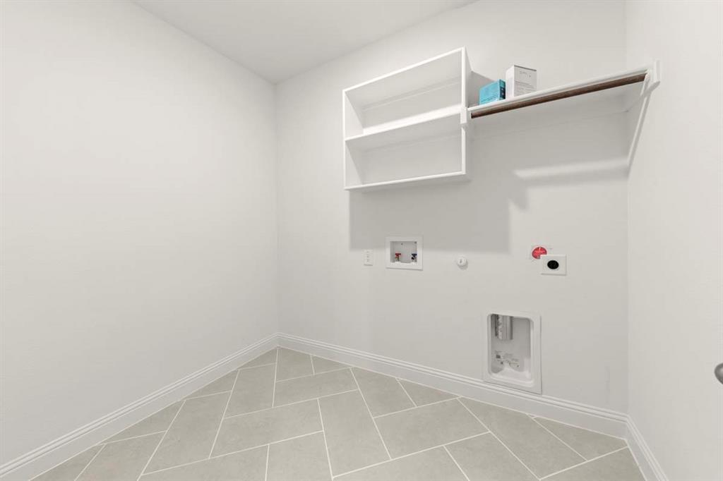 1443 Canadian Lane Van Alstyne, TX 75495 - Photo 21 of 24 22-1443-canadian-ln-van-alstyne-tx-laundry-room