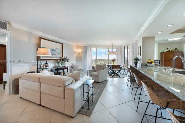 a living room with furniture a flat screen tv and a table