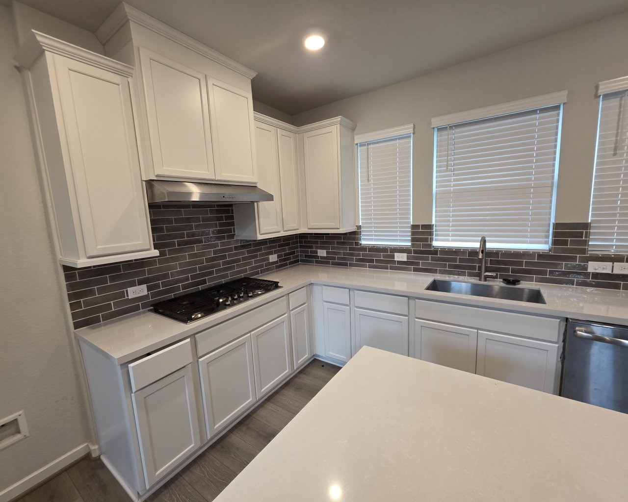 396 Weimer Lagoon Road La Porte, TX 77571 - Photo 4 of 25 a kitchen with granite countertop a sink a stove and cabinets