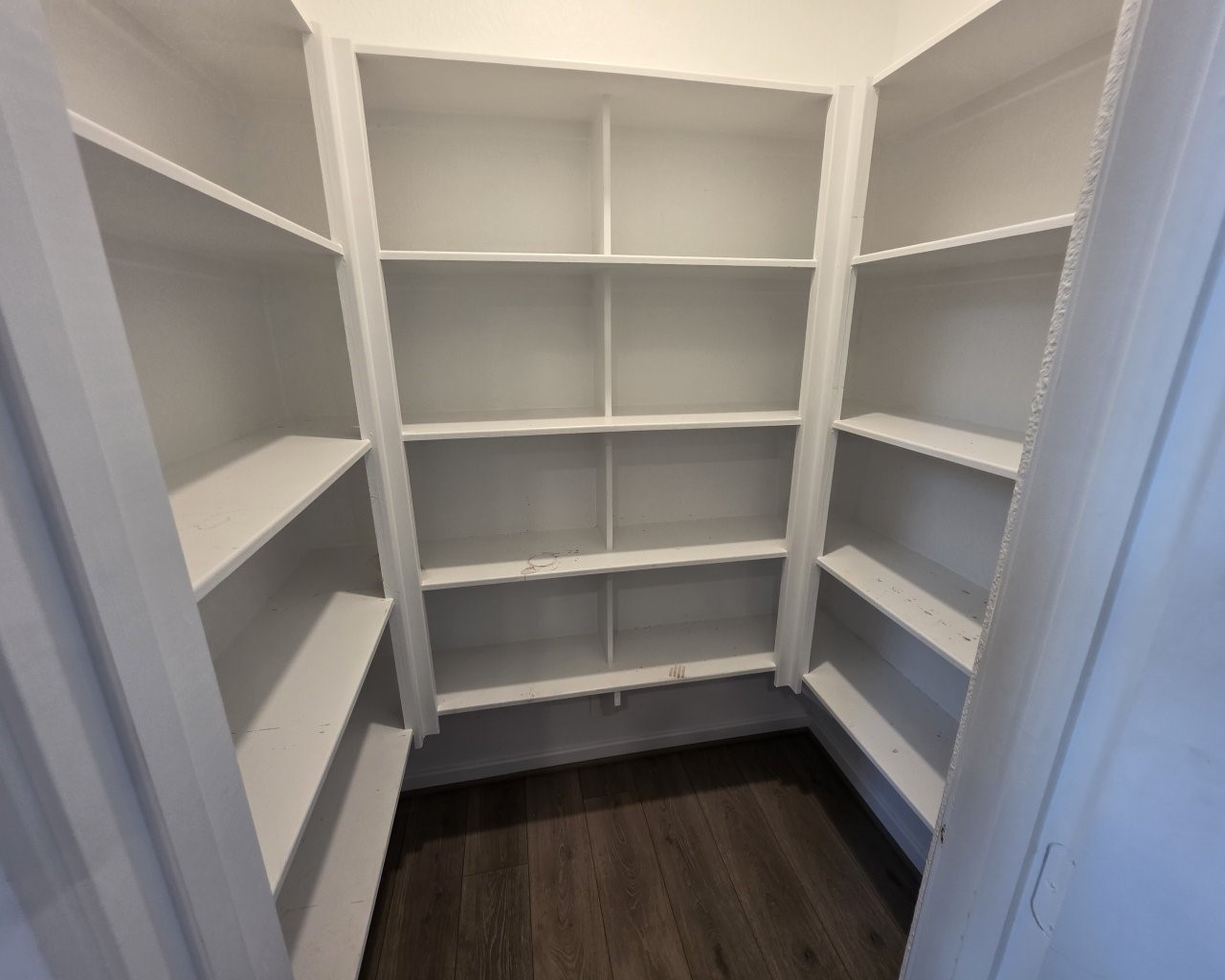 396 Weimer Lagoon Road La Porte, TX 77571 - Photo 7 of 25 a storage room with wooden floor
