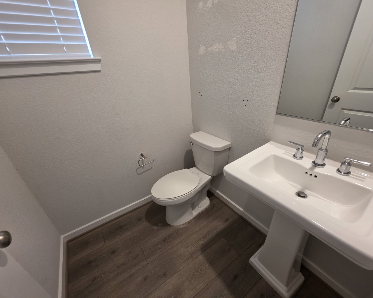 396 Weimer Lagoon Road La Porte, TX 77571 - Photo 10 of 25 a bathroom with a sink and a toilet