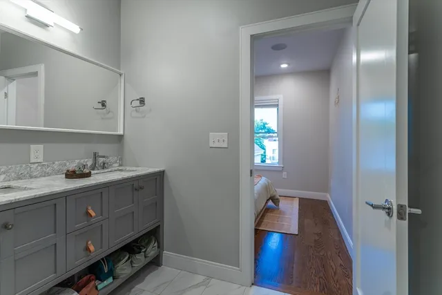 a view of balcony with floor to ceiling windows wooden floor