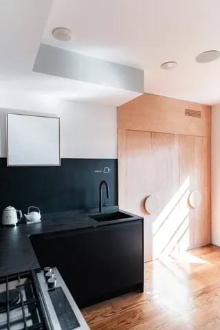 a kitchen with a sink and a stove