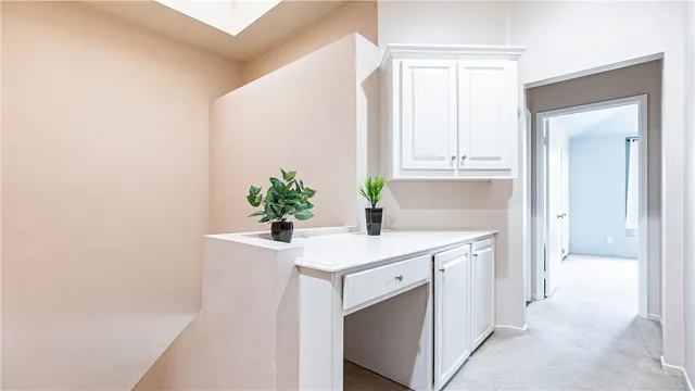 a bathroom with a sink a toilet a mirror and shower curtain