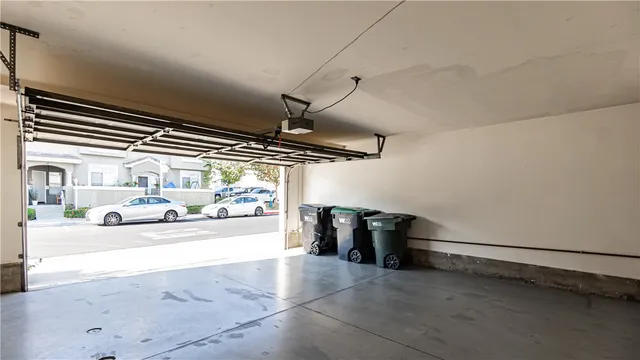 a view of cars parked in front of a house