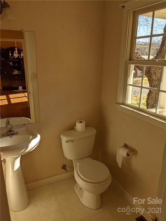 106 Cameron Drive Rutherfordton, NC 28139 - Photo 8 of 19 a bathroom with a toilet sink and mirror