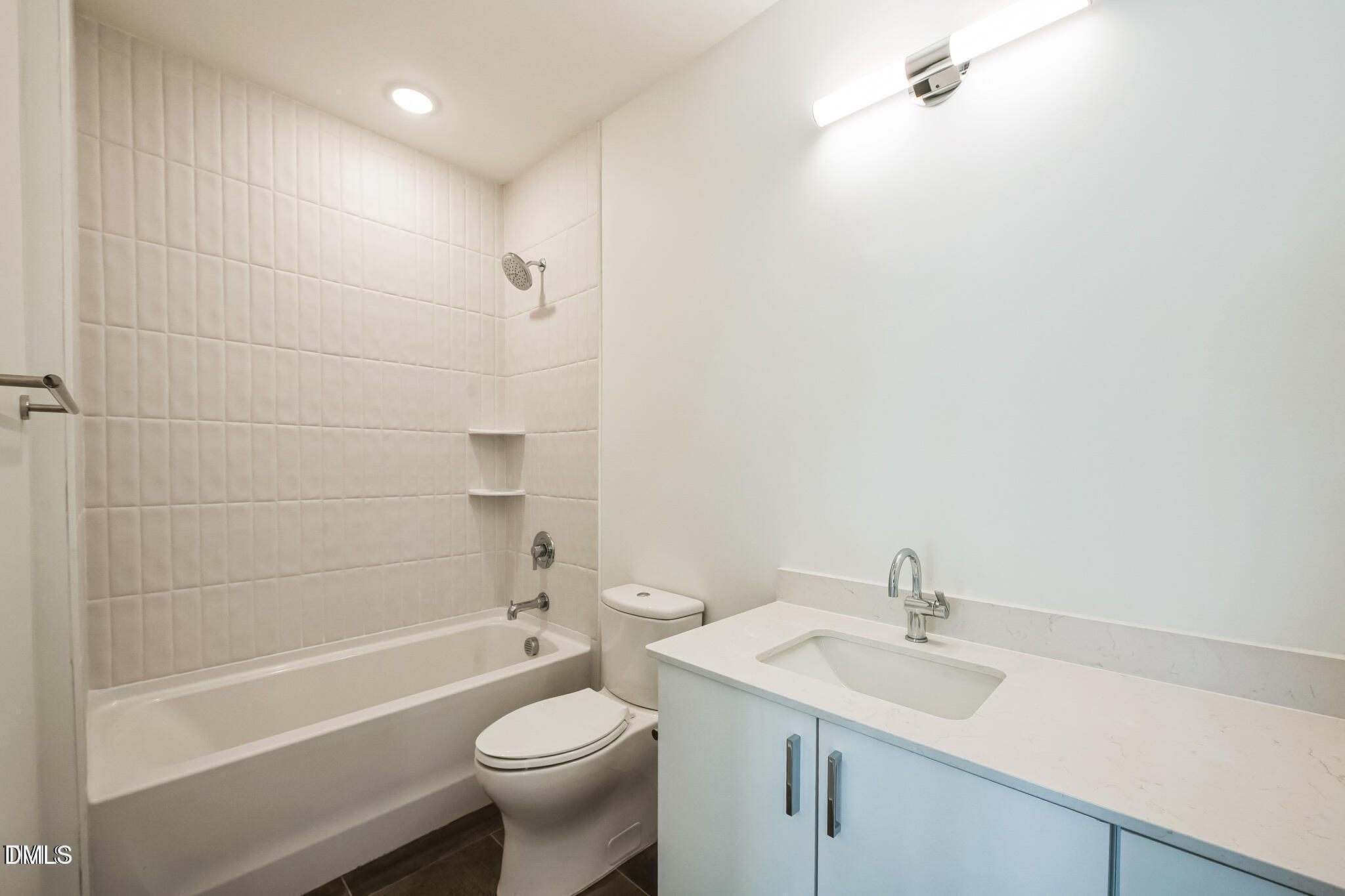 29 Enterprise Street, Unit 109 Raleigh, NC 27607 - Photo 15 of 18 a bathroom with a sink toilet and shower