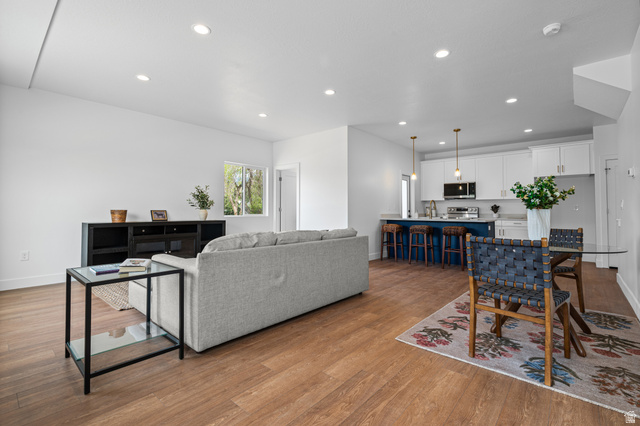 340 East 7635 S Street Sandy, UT 84047 - Photo 10 of 32 Living room featuring recessed lighting and light wood-type flooring
