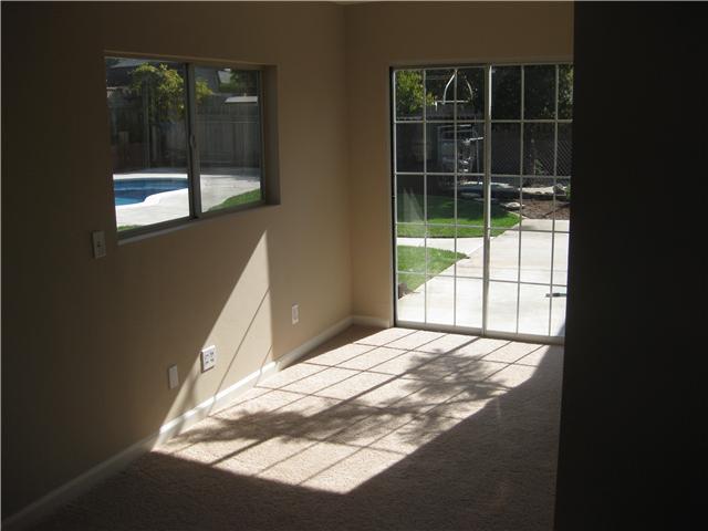 143 Valpreda Road San Marcos, CA 92069 - Photo 10 of 22 This is the master bedroom. extra space is a "foyer' entry to your pool and to your bathroom.