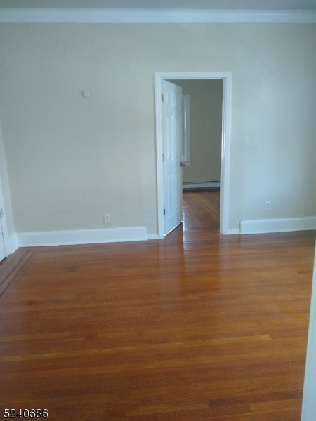 326 Field Place, Unit 2L Hillside, NJ 07205 - Photo 2 of 17 a view of room and wooden floor
