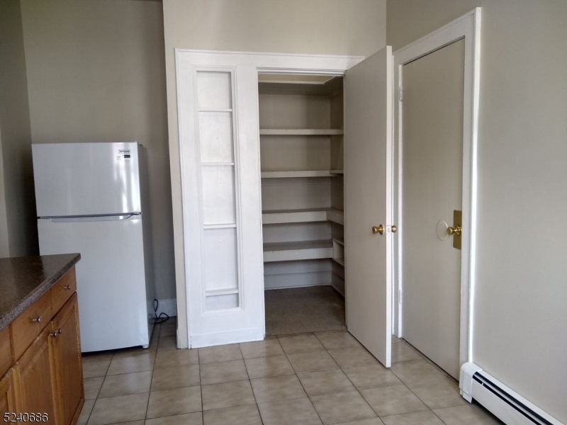 326 Field Place, Unit 2L Hillside, NJ 07205 - Photo 8 of 17 a view of walk in closet with empty racks