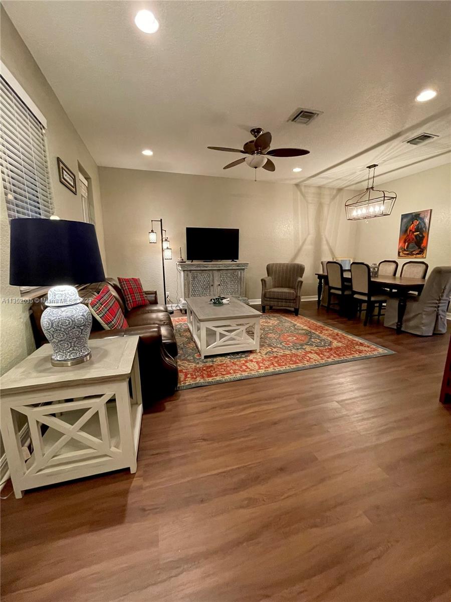 128 Midleton Way Jupiter, FL 33458 - Photo 15 of 39 a living room with furniture and a flat screen tv