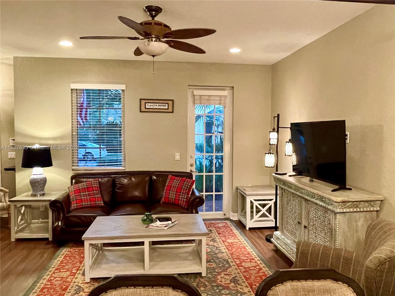 128 Midleton Way Jupiter, FL 33458 - Photo 16 of 39 a living room with furniture and a flat screen tv