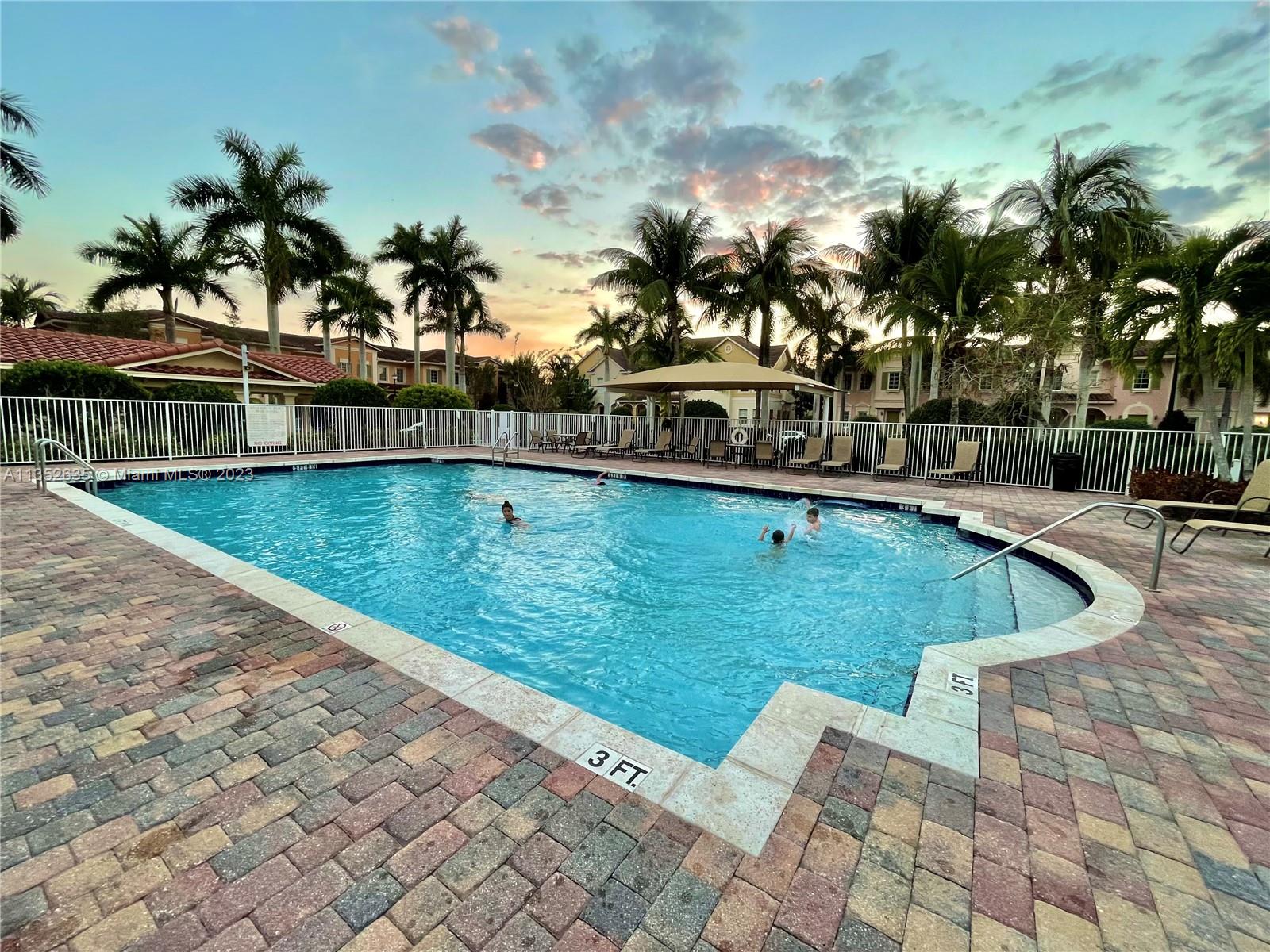 128 Midleton Way Jupiter, FL 33458 - Photo 19 of 39 a view of a swimming pool with an outdoor seating