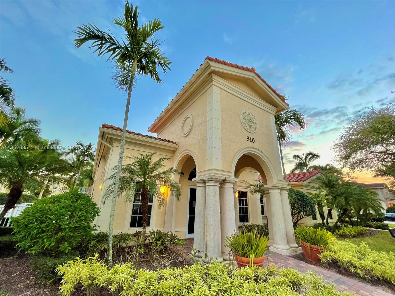 128 Midleton Way Jupiter, FL 33458 - Photo 20 of 39 a front view of a house with garden