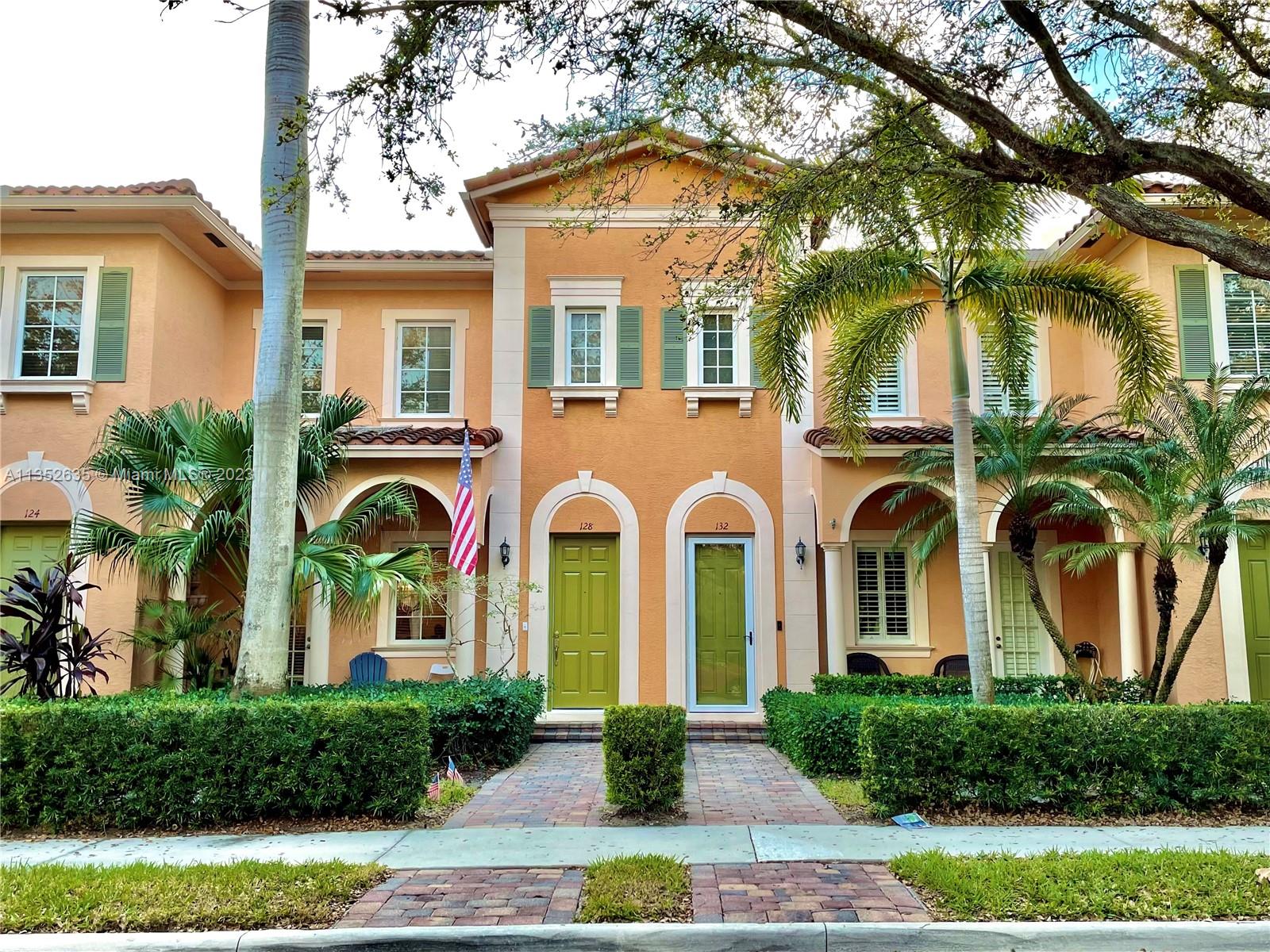 128 Midleton Way Jupiter, FL 33458 - Photo 2 of 39 front view of a house with a yard