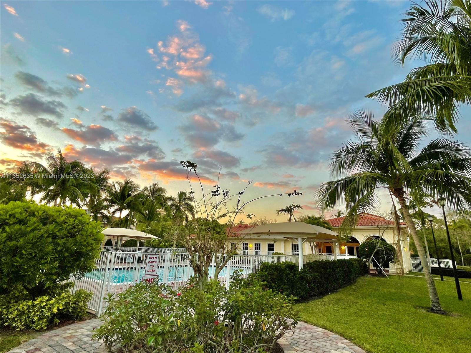 128 Midleton Way Jupiter, FL 33458 - Photo 21 of 39 a front view of a house with a garden