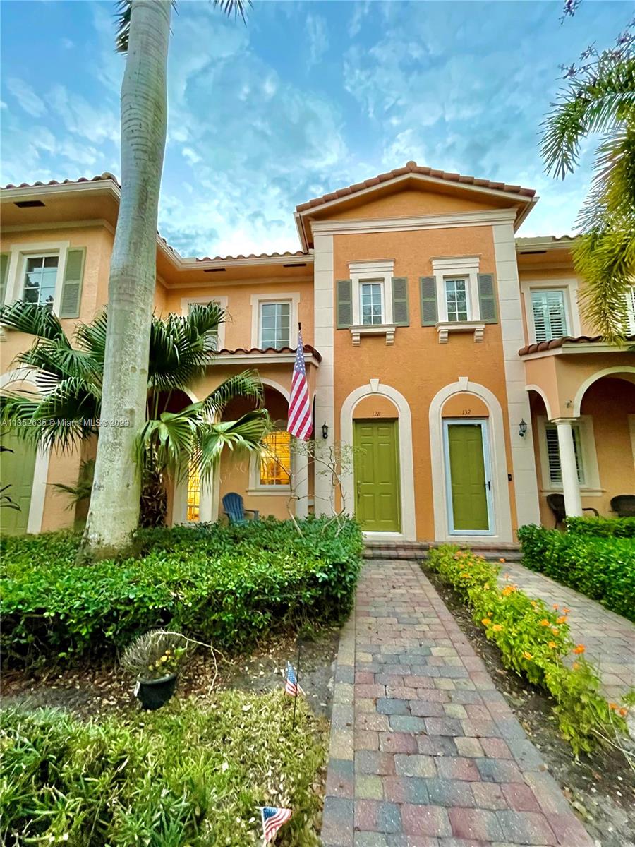128 Midleton Way Jupiter, FL 33458 - Photo 27 of 39 a front view of a house with a yard
