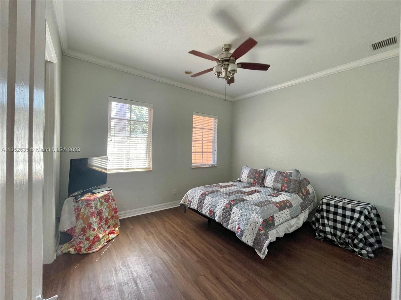 128 Midleton Way Jupiter, FL 33458 - Photo 28 of 39 a bedroom with bed and window