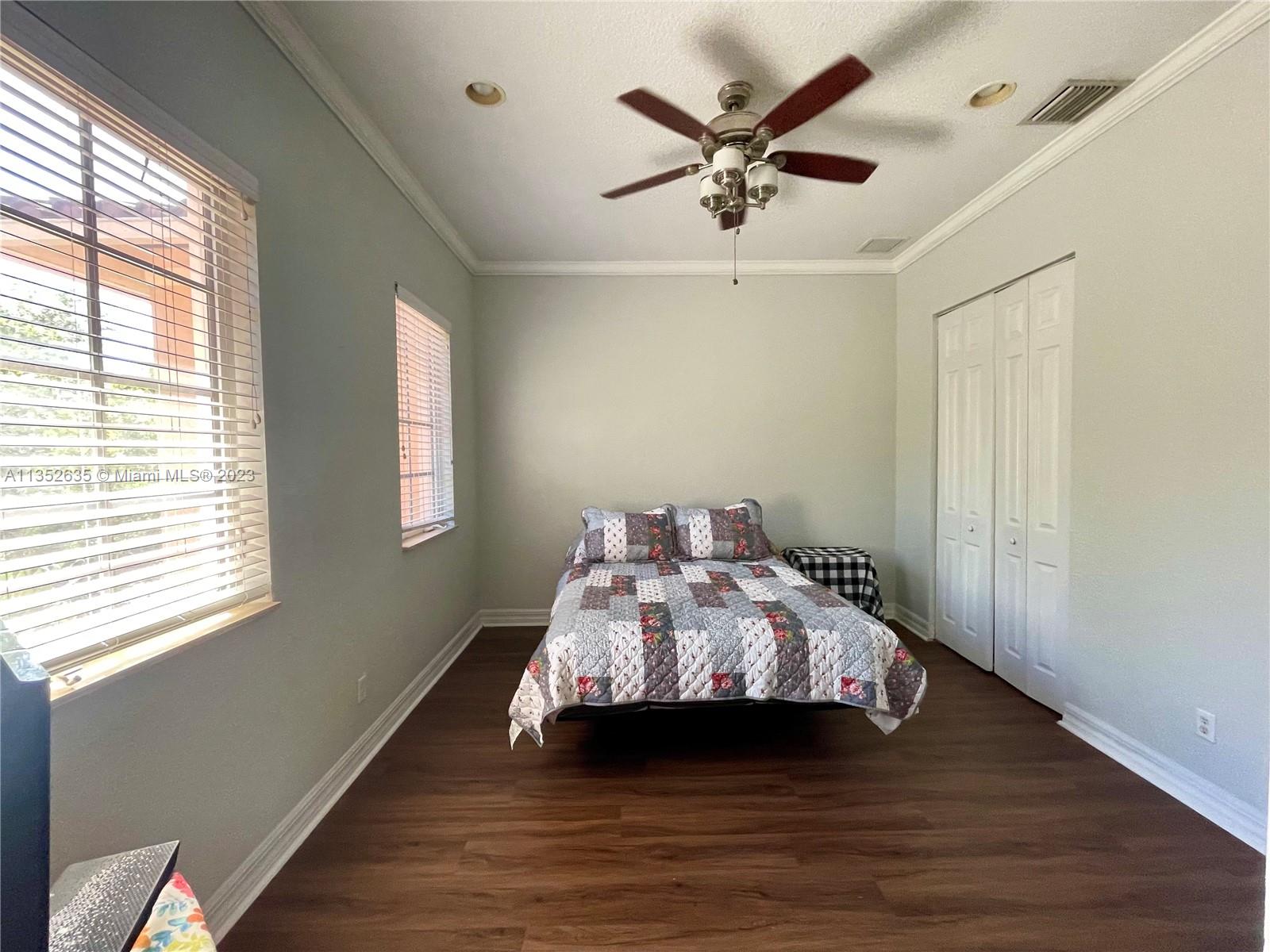 128 Midleton Way Jupiter, FL 33458 - Photo 29 of 39 a bedroom with a bed and a window