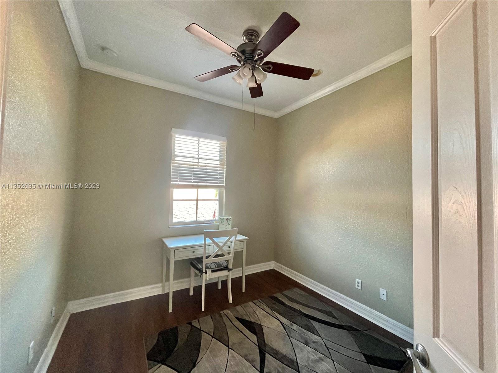 128 Midleton Way Jupiter, FL 33458 - Photo 32 of 39 a room with furniture and a window