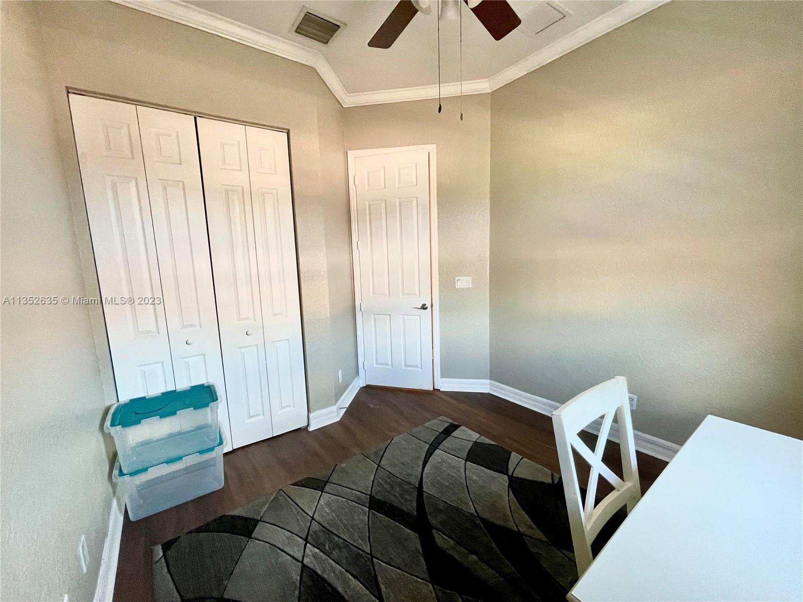 128 Midleton Way Jupiter, FL 33458 - Photo 33 of 39 a bedroom with a bed and a window