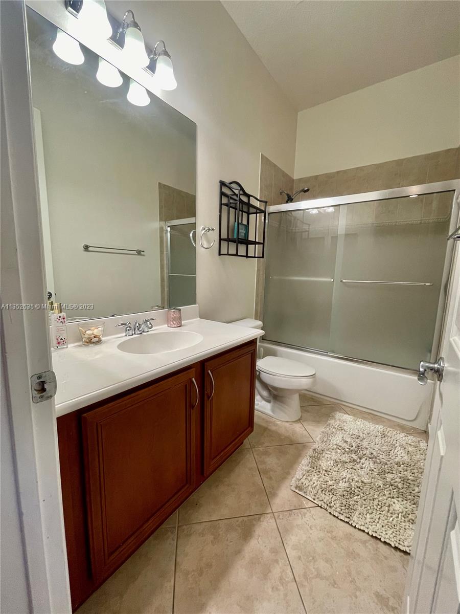 128 Midleton Way Jupiter, FL 33458 - Photo 34 of 39 a bathroom with a sink a toilet and shower