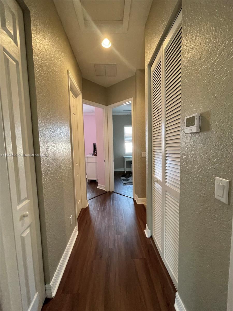 128 Midleton Way Jupiter, FL 33458 - Photo 37 of 39 a view of hallway with wooden floor