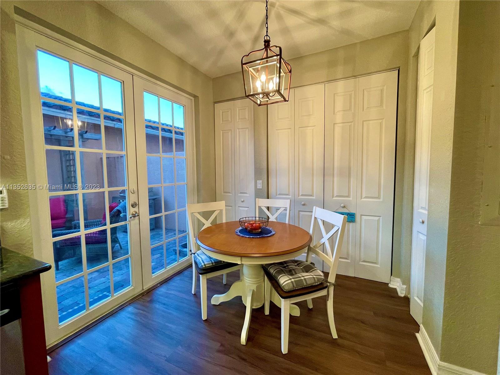128 Midleton Way Jupiter, FL 33458 - Photo 10 of 39 a dining room with furniture and wooden floor