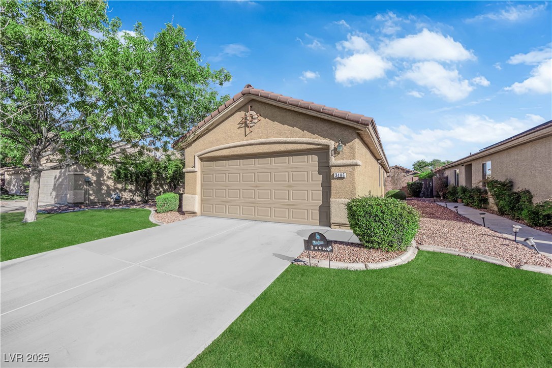 3486 Osprey Ridge Court Las Vegas, NV 89122 - Photo 5 of 49 Virtually staged. Artificial grass installed soon!