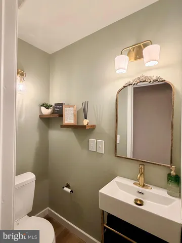 an aerial view of residential house with outdoor space and trees all around