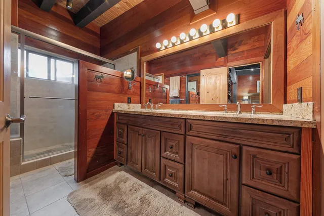 a bathroom with a sink and a large mirror