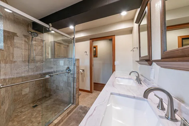 a bathroom with a sink and shower