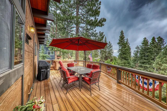 a view of balcony with chairs and wooden floor
